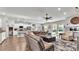 Spacious living room with hardwood floors, fireplace and access to pool at 241 Walkers Point Dr, Auburndale, FL 33823