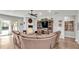 Gathering room with sectional sofa, fireplace, and built-in entertainment center at 241 Walkers Point Dr, Auburndale, FL 33823
