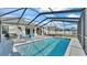 Large screened pool with plenty of space for lounging at 241 Walkers Point Dr, Auburndale, FL 33823