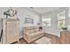 Comfortable sitting room with hardwood floors and lots of natural light at 241 Walkers Point Dr, Auburndale, FL 33823