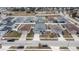 Aerial view of a residential neighborhood with houses and landscaping at 416 Monticelli Dr, Haines City, FL 33844