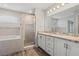 Double vanity bathroom with soaking tub and walk-in shower at 416 Monticelli Dr, Haines City, FL 33844
