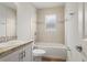 Clean bathroom with tub, shower, and updated vanity at 416 Monticelli Dr, Haines City, FL 33844