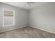 Simple bedroom with neutral walls and carpet flooring at 416 Monticelli Dr, Haines City, FL 33844