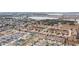 Aerial view of a residential neighborhood with houses and solar panels at 416 Monticelli Dr, Haines City, FL 33844