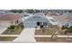 Single-story home with gray exterior and landscaped yard at 416 Monticelli Dr, Haines City, FL 33844