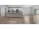 Open kitchen with stainless steel appliances and island at 416 Monticelli Dr, Haines City, FL 33844