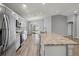 Open concept kitchen with island and stainless steel appliances at 416 Monticelli Dr, Haines City, FL 33844