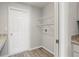 Laundry room with wire shelving and wood flooring at 416 Monticelli Dr, Haines City, FL 33844
