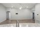 Bright and spacious living area features wood-look floors and recessed lighting at 416 Monticelli Dr, Haines City, FL 33844