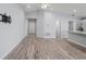 Open living space with wood-look floors and high ceilings at 416 Monticelli Dr, Haines City, FL 33844