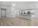 Spacious living room with wood-look floors and high ceilings at 416 Monticelli Dr, Haines City, FL 33844