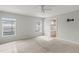 Spacious main bedroom with two windows and ensuite bathroom access at 416 Monticelli Dr, Haines City, FL 33844