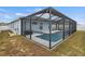 Screened pool and patio area with pump and filter equipment at 416 Monticelli Dr, Haines City, FL 33844