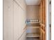 Unfinished storage room with wooden shelves at 4241 Oak Loop # 36, Mulberry, FL 33860