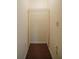 Small closet with wire shelving and carpeted floor at 4243 Oak Loop # 35, Mulberry, FL 33860
