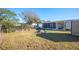 Backyard with shed and screened patio area at 4307 Meadow Ridge Ct, Mulberry, FL 33860