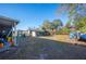 Backyard area with landscaping and sheds at 4307 Meadow Ridge Ct, Mulberry, FL 33860