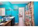 Bathroom with teal walls, shower, and vanity at 4307 Meadow Ridge Ct, Mulberry, FL 33860