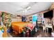 Large bedroom with an orange comforter and plenty of storage at 4307 Meadow Ridge Ct, Mulberry, FL 33860