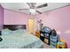 Bedroom with double bed, ceiling fan, and storage at 4307 Meadow Ridge Ct, Mulberry, FL 33860