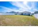 Large backyard with grassy area, privacy fence, and playground at 4340 Reding Way, Lakeland, FL 33813