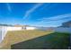 Spacious backyard with a climbing dome and a large grassy area at 4340 Reding Way, Lakeland, FL 33813