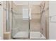 Updated bathroom with a shower/tub combo and neutral tile at 4340 Reding Way, Lakeland, FL 33813