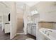 Bathroom with shower, vanity, and corner tub at 4340 Reding Way, Lakeland, FL 33813