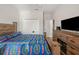 Main bedroom with large bed, dresser, and fireplace at 4340 Reding Way, Lakeland, FL 33813