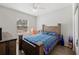 Bedroom with wooden bed frame and Florida Gators bedding at 4340 Reding Way, Lakeland, FL 33813