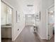 Bright hallway with wood-look floors and mirrors at 4340 Reding Way, Lakeland, FL 33813