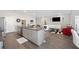 Open concept kitchen and living area, featuring granite and stainless steel at 4340 Reding Way, Lakeland, FL 33813