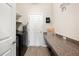 Convenient laundry room with built-in shelving and countertop space at 4340 Reding Way, Lakeland, FL 33813
