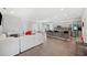 Open concept living area with white sectional sofa and kitchen at 4340 Reding Way, Lakeland, FL 33813