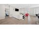 Open living space with white sectional and red accent chair at 4340 Reding Way, Lakeland, FL 33813