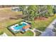 Community pool and surrounding area with lush landscaping at 506 Pine Cone Dr, Davenport, FL 33897