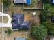 Aerial view of a house, showing the driveway, yard, and pool at 5545 Harrells Nursery Rd, Lakeland, FL 33812