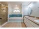 Elegant bathroom with a soaking tub, shower, and double vanity at 5545 Harrells Nursery Rd, Lakeland, FL 33812
