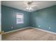Well lit bedroom featuring carpet flooring and a ceiling fan at 5545 Harrells Nursery Rd, Lakeland, FL 33812