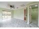 Large bedroom with marble tile floors and ceiling fan at 5545 Harrells Nursery Rd, Lakeland, FL 33812