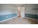 Spacious bedroom with carpet flooring, ceiling fan and access to hallway at 5545 Harrells Nursery Rd, Lakeland, FL 33812