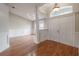 Bright entryway with hardwood floors and white doors at 5545 Harrells Nursery Rd, Lakeland, FL 33812