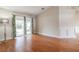 Bright living room with hardwood floors and sliding glass doors leading to backyard at 5545 Harrells Nursery Rd, Lakeland, FL 33812