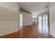 Spacious living area featuring hardwood floors and access to backyard patio at 5545 Harrells Nursery Rd, Lakeland, FL 33812
