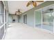 Large screened porch with multiple ceiling fans and views of backyard at 5545 Harrells Nursery Rd, Lakeland, FL 33812