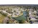 Community of homes centered around a pond, aerial view at 731 Lake Clark Ct, Lakeland, FL 33813