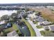 Community of homes surrounding a pond, aerial view at 731 Lake Clark Ct, Lakeland, FL 33813