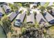 Aerial view of neighborhood homes with pool at 731 Lake Clark Ct, Lakeland, FL 33813