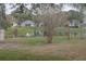 Peaceful backyard view of a pond and lush landscaping at 731 Lake Clark Ct, Lakeland, FL 33813